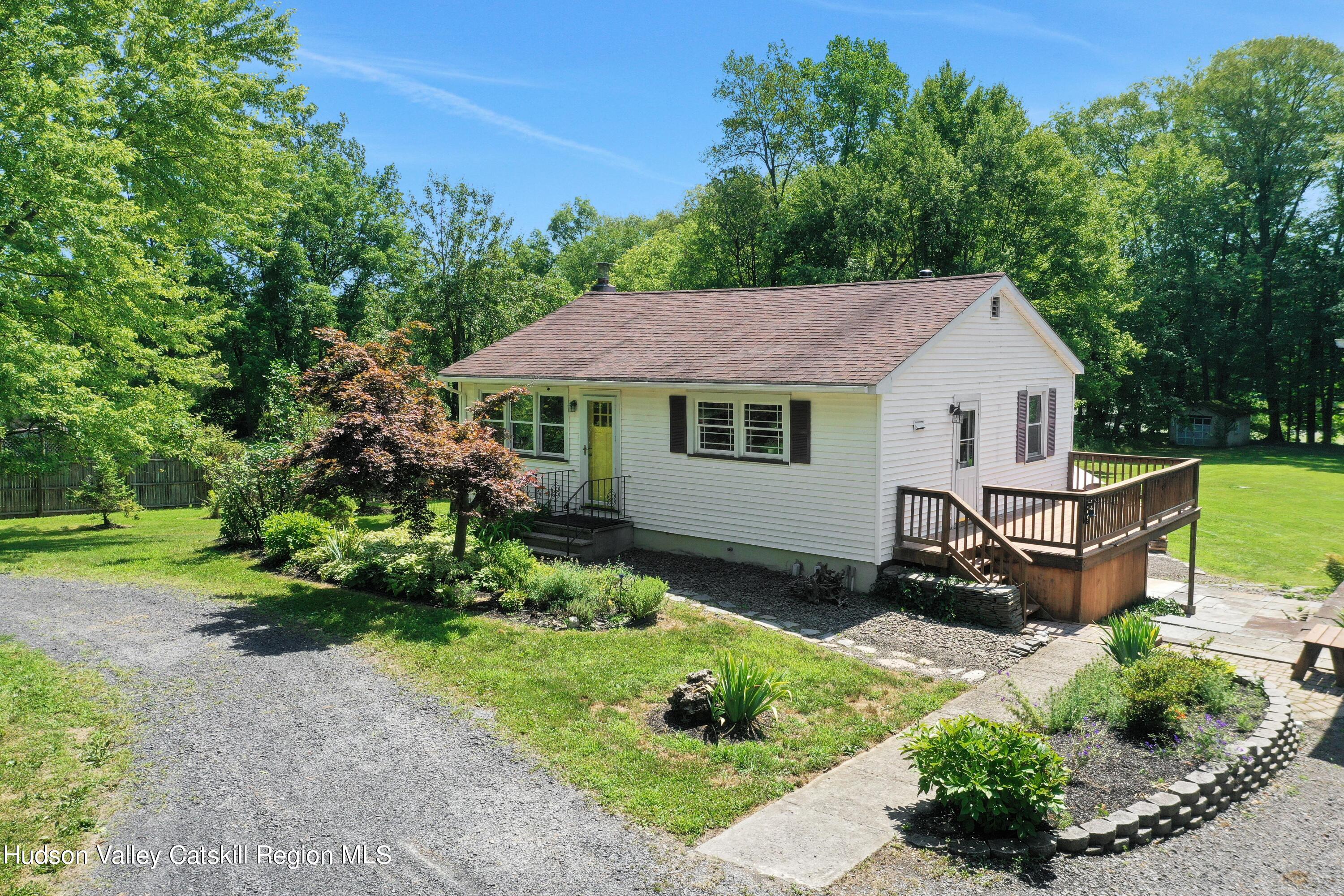 667 Albany Post Road New Paltz, NY 12561 - Photo 44 of 44 a aerial view of a house with a yard and a garden
