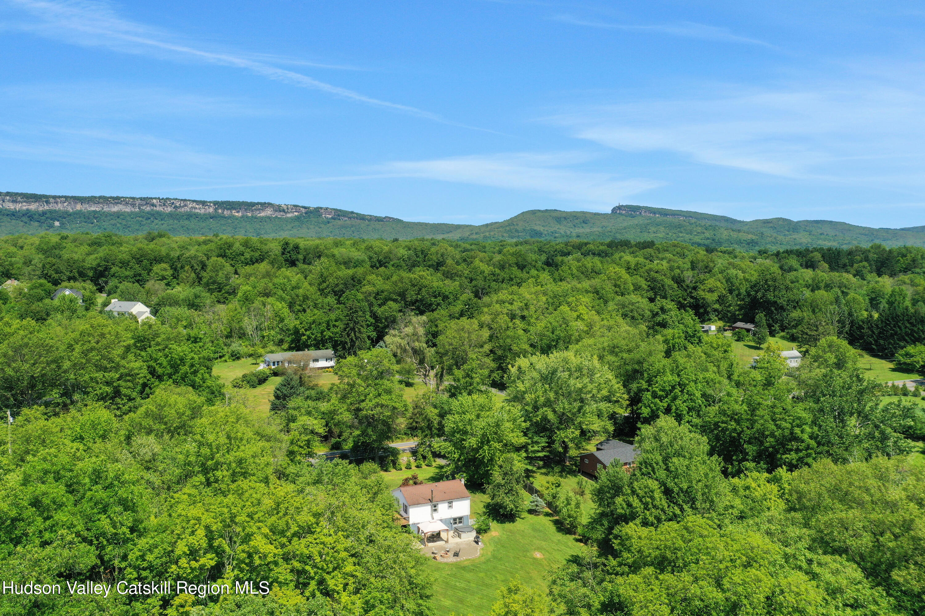 667 Albany Post Road New Paltz, NY 12561 - Photo 6 of 44 a view of a lush green mountain in the distance in a field