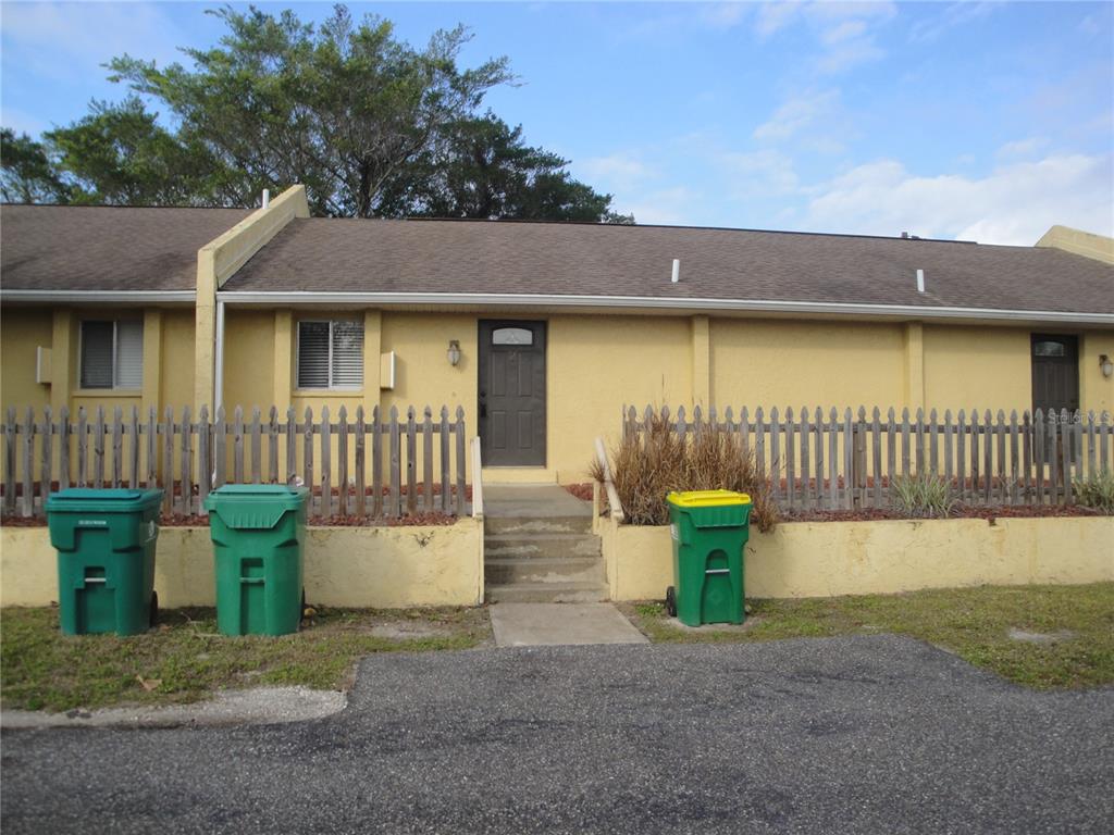 3121 Vasco Street, Unit 2 Punta Gorda, FL 33950 - Photo 1 of 17 a front view of a house with sitting area