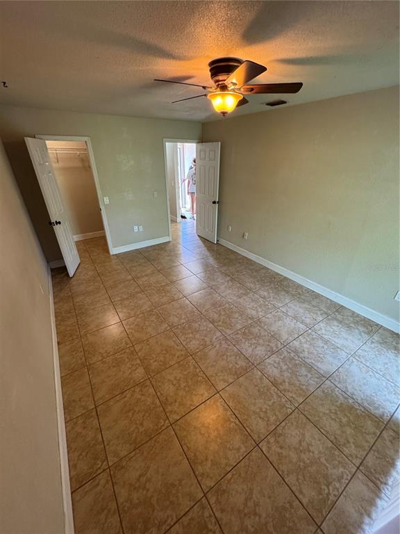 3121 Vasco Street, Unit 2 Punta Gorda, FL 33950 - Photo 16 of 17 a view of an empty room with a chandelier fan