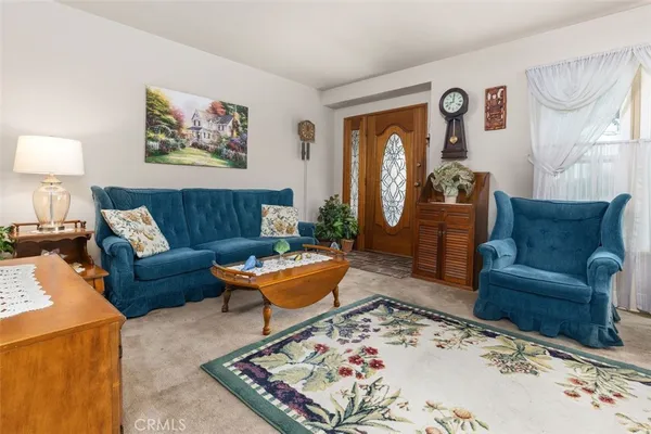 a living room with furniture and a rug