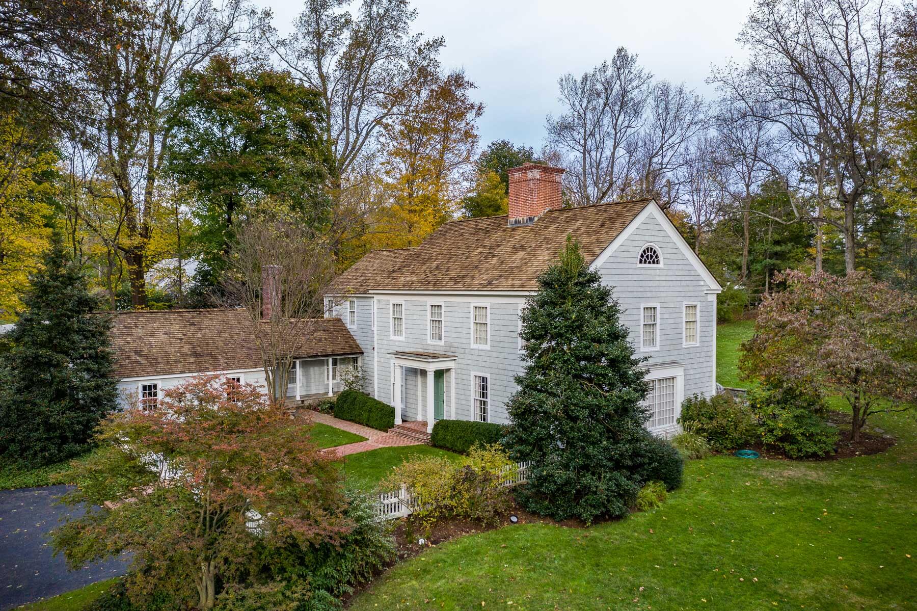 840 Hollow Tree Ridge Road Darien, CT 06820 - Photo 2 of 27 a front view of house with yard and green space