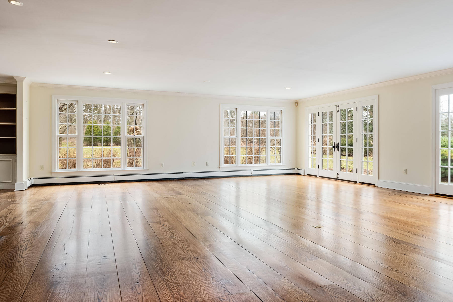 840 Hollow Tree Ridge Road Darien, CT 06820 - Photo 11 of 27 wooden floor in an empty room with a window