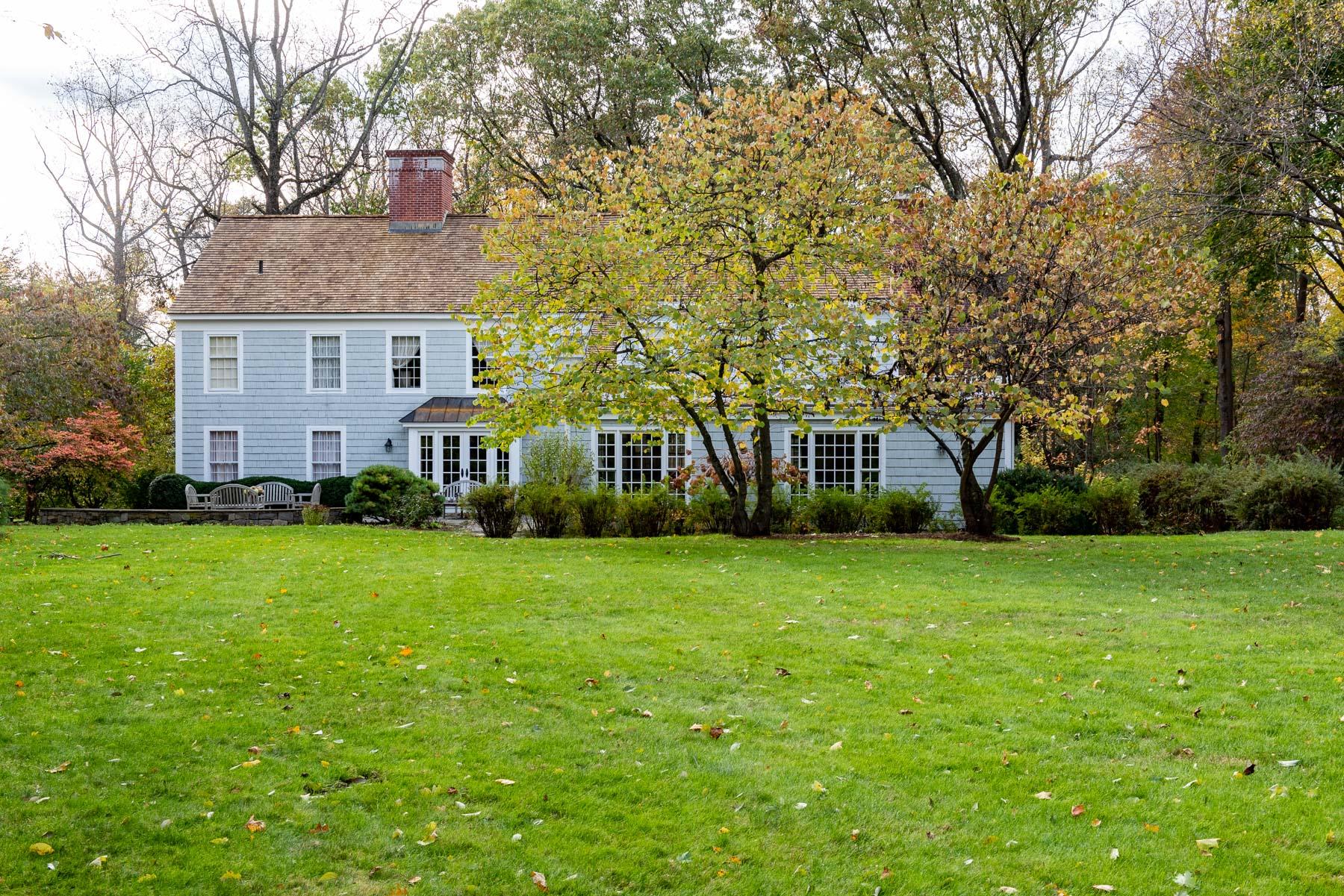840 Hollow Tree Ridge Road Darien, CT 06820 - Photo 14 of 27 a front view of a house with a garden