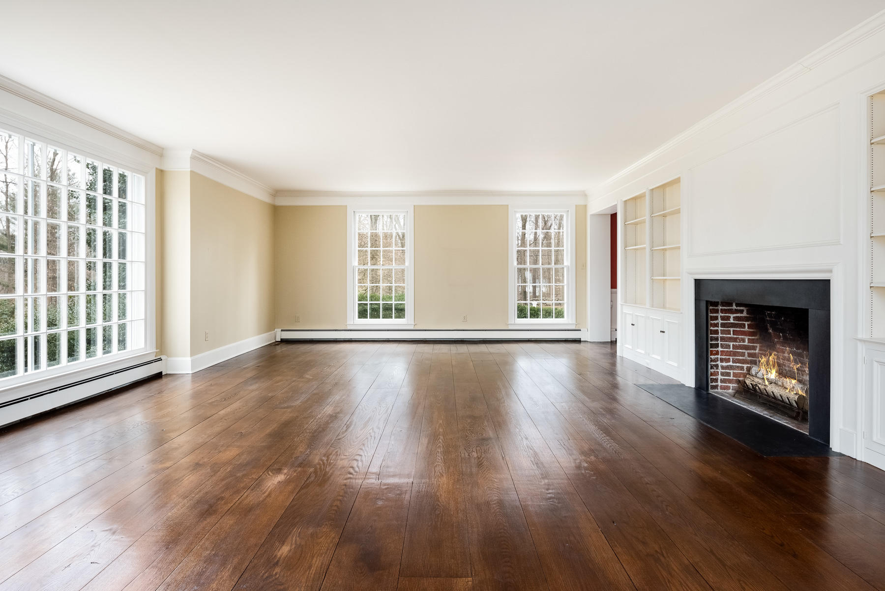 840 Hollow Tree Ridge Road Darien, CT 06820 - Photo 15 of 27 an empty room with wooden floor and windows