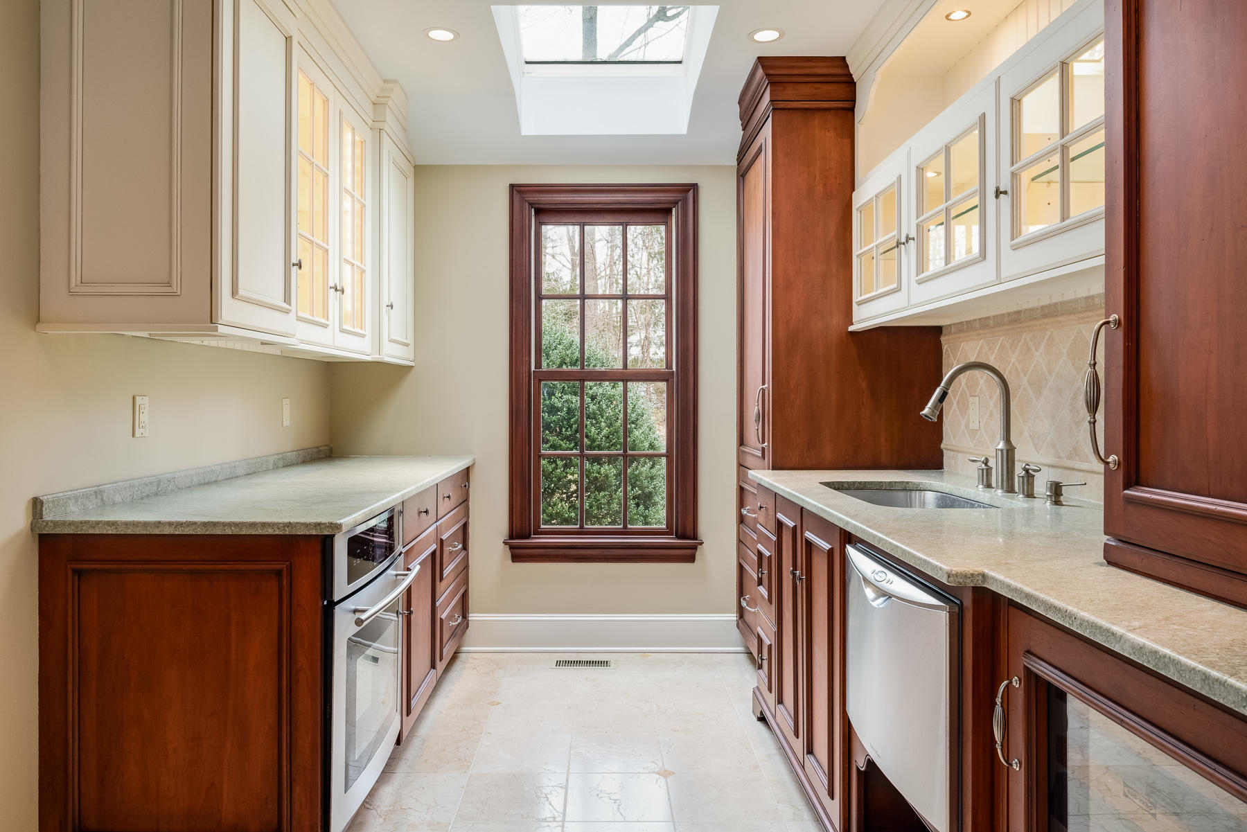 840 Hollow Tree Ridge Road Darien, CT 06820 - Photo 17 of 27 a kitchen that has a sink and a stove