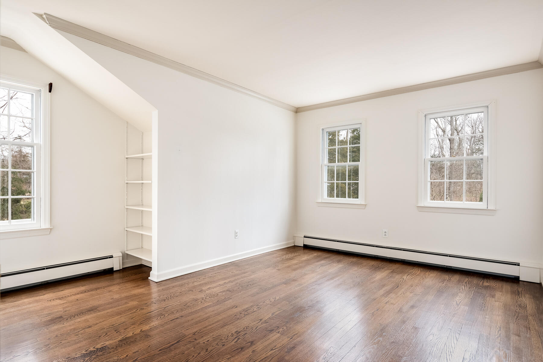 840 Hollow Tree Ridge Road Darien, CT 06820 - Photo 23 of 27 an empty room with wooden floor and windows