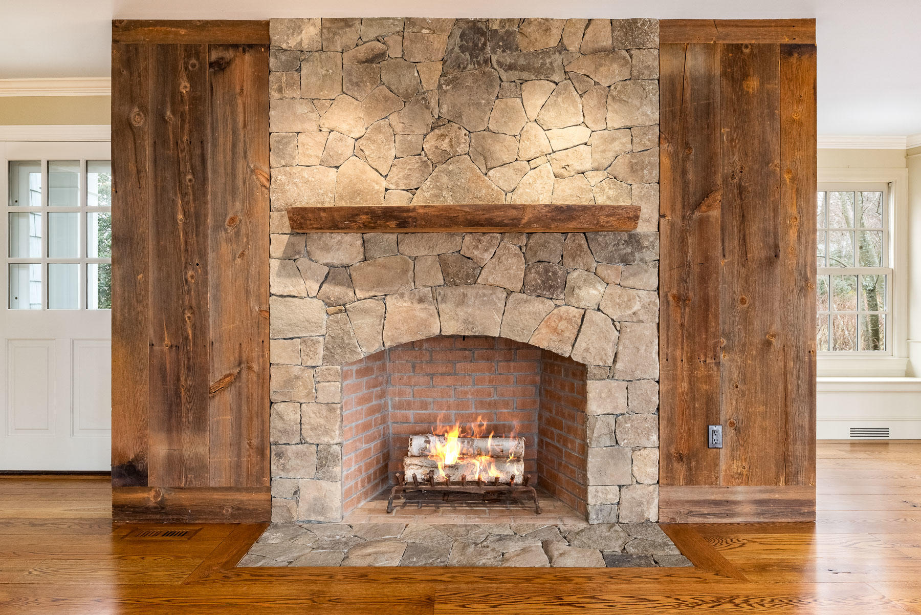 840 Hollow Tree Ridge Road Darien, CT 06820 - Photo 5 of 27 a living room with a fireplace