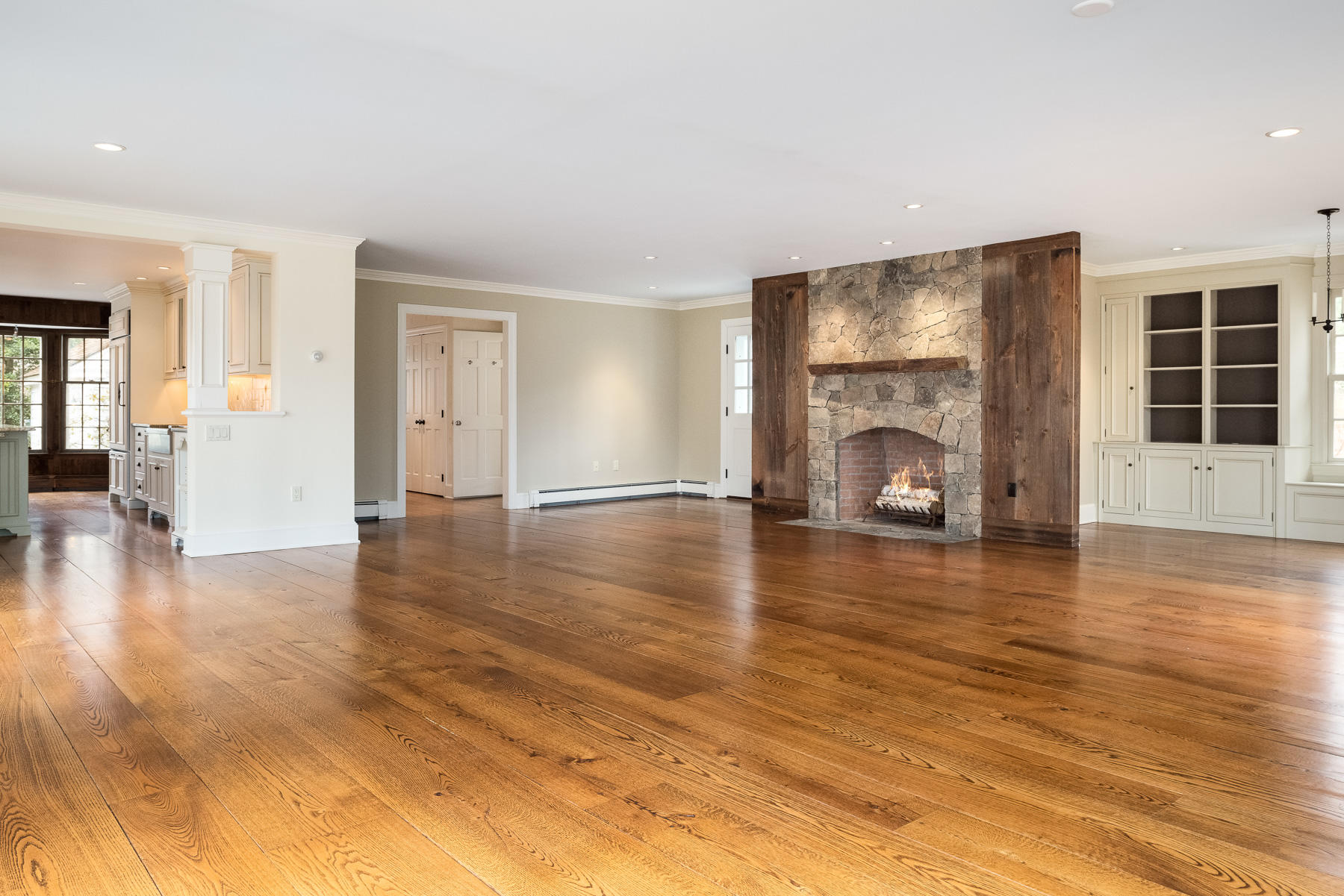 840 Hollow Tree Ridge Road Darien, CT 06820 - Photo 6 of 27 a view of livingroom with hardwood floor and a fireplace
