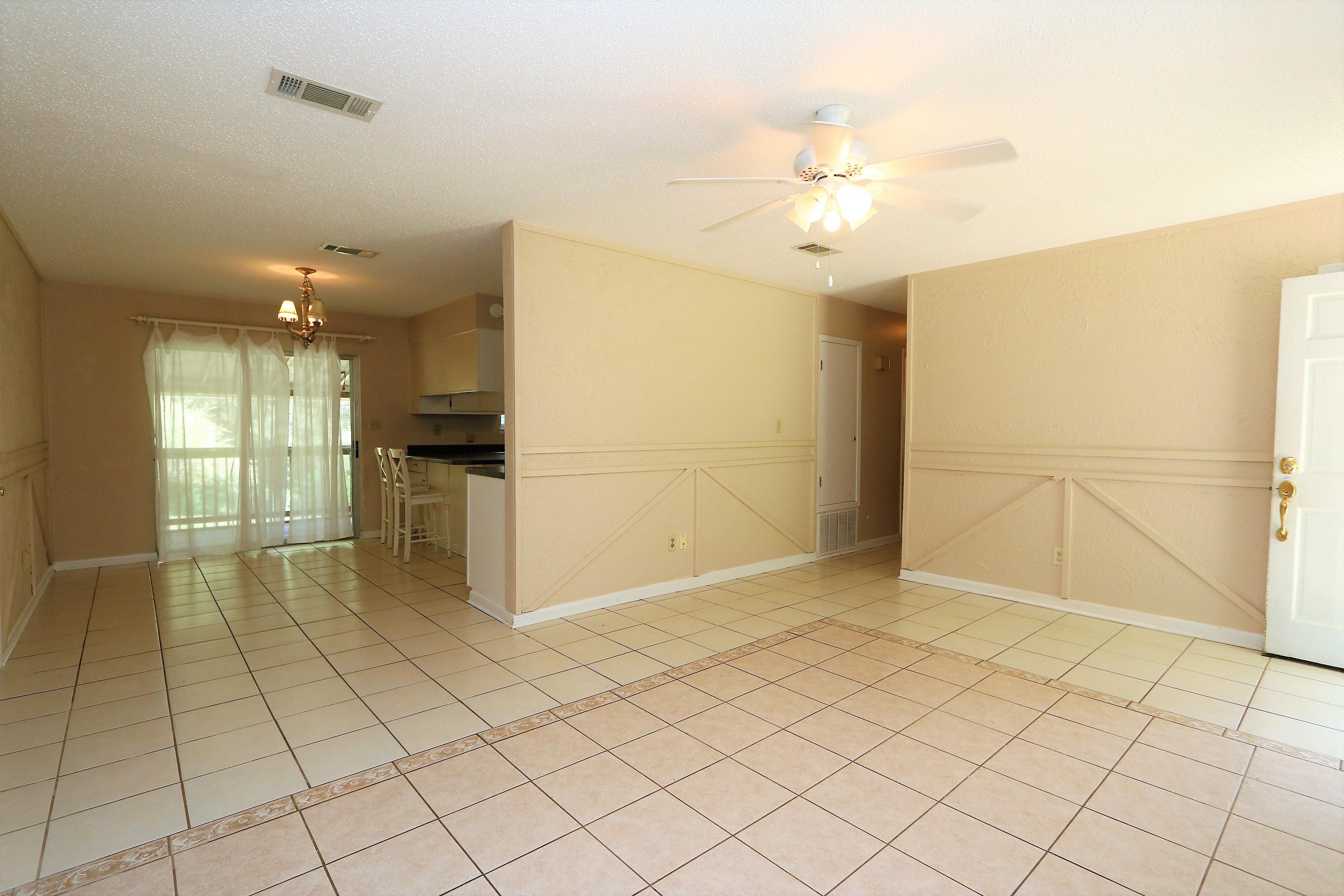 3097 Bay Ridge Drive Crestview, FL 32539 - Photo 15 of 21 a view of a kitchen with a sink and a refrigerator
