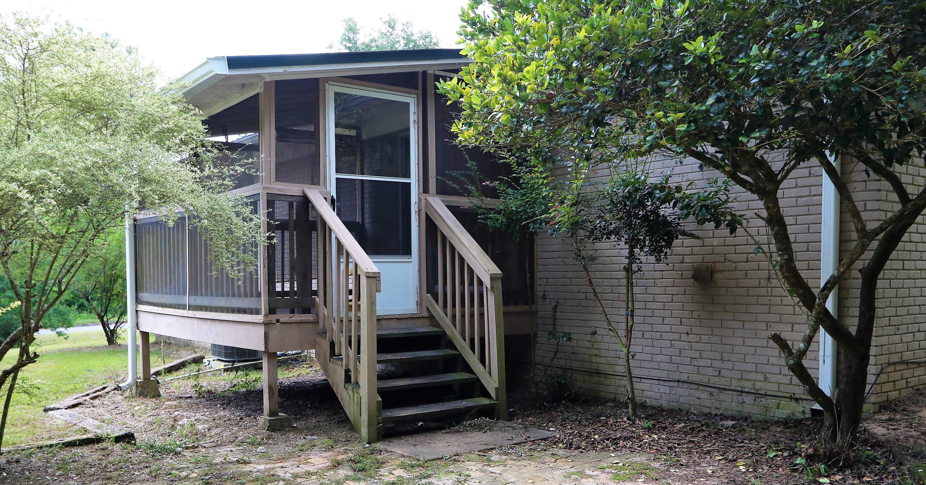 3097 Bay Ridge Drive Crestview, FL 32539 - Photo 19 of 21 a view of house with backyard and trees