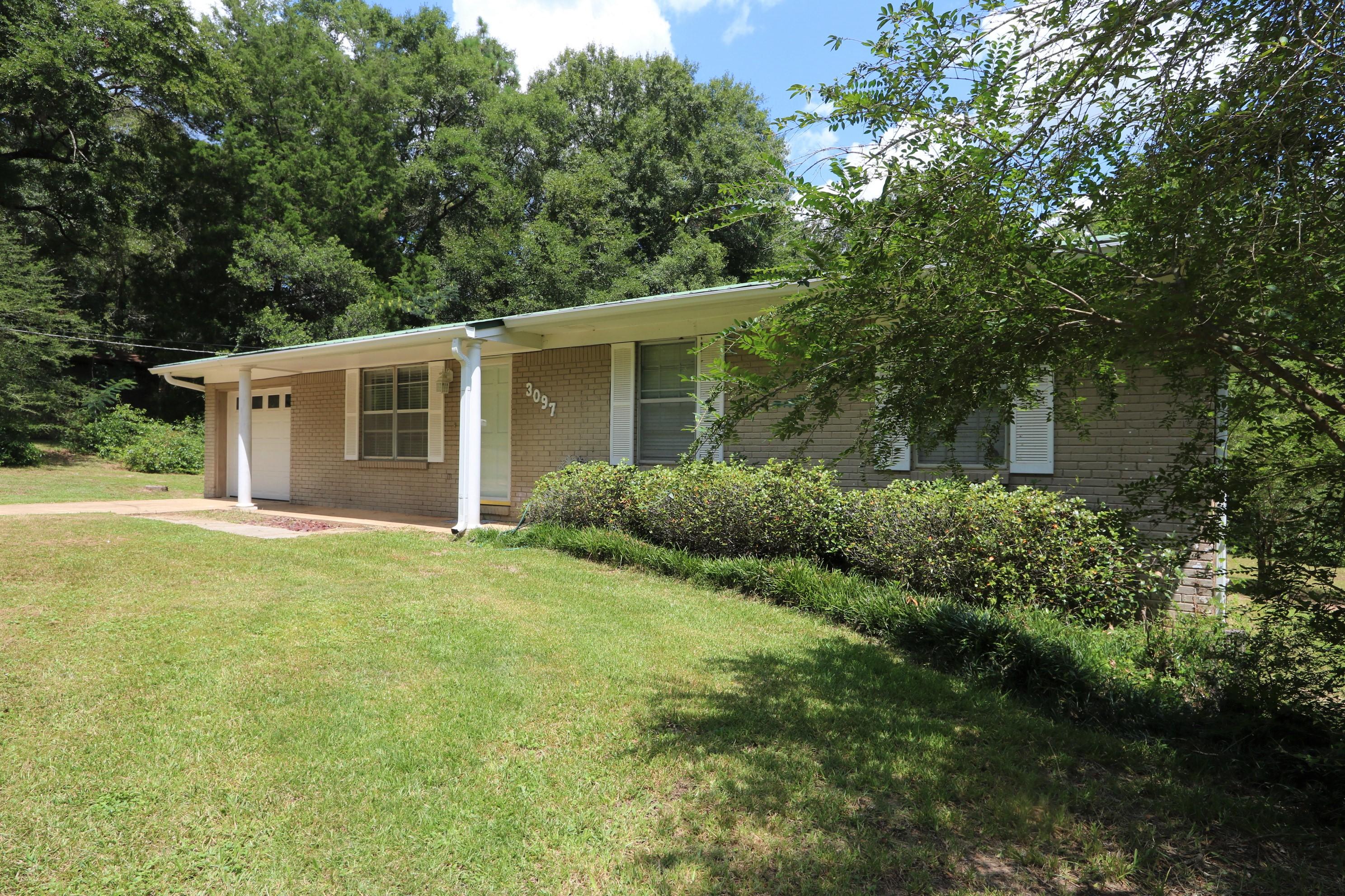 3097 Bay Ridge Drive Crestview, FL 32539 - Photo 3 of 21 a view of a house with backyard and garden