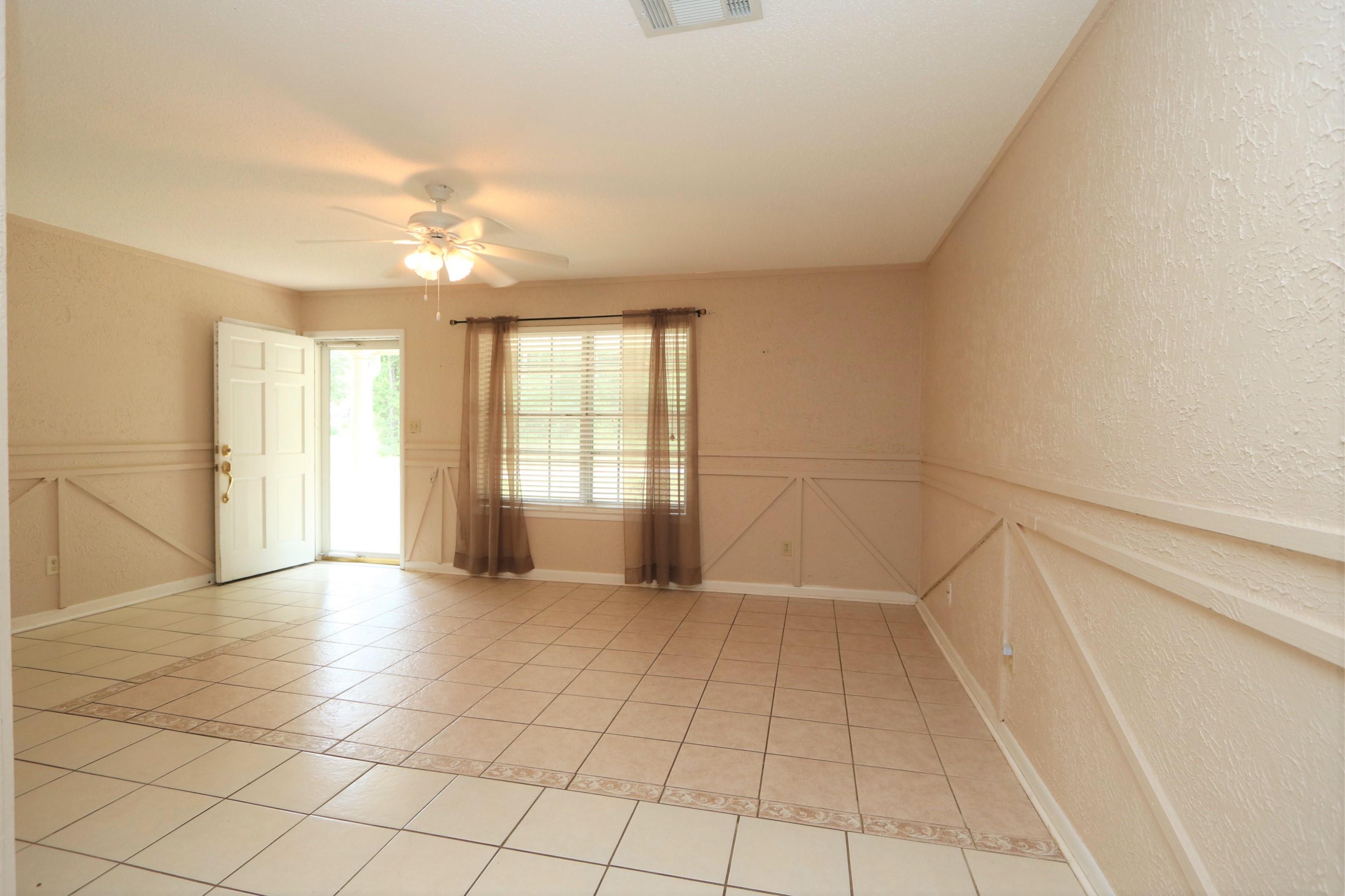 3097 Bay Ridge Drive Crestview, FL 32539 - Photo 6 of 21 a view of an empty room with a window