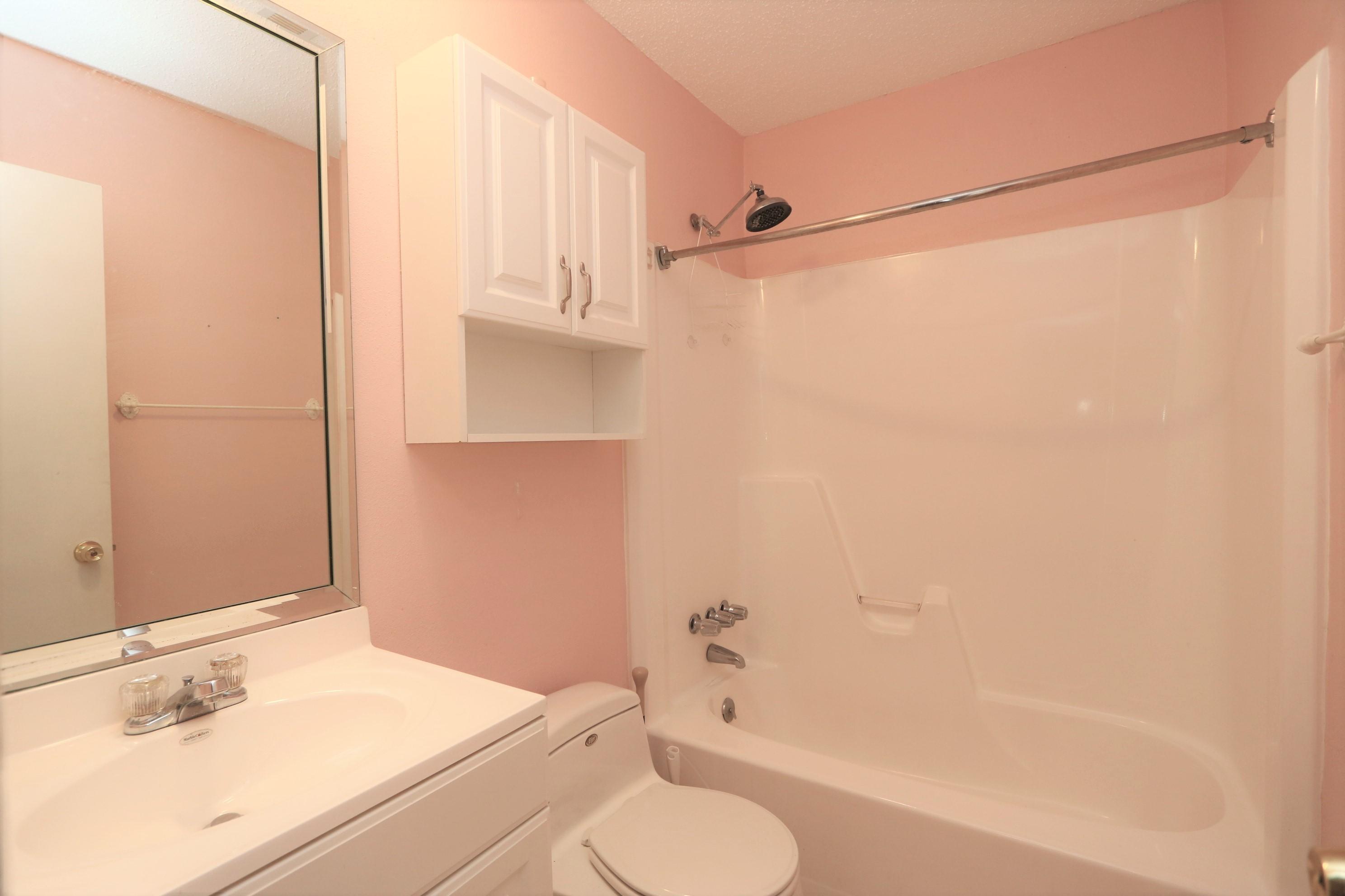 3097 Bay Ridge Drive Crestview, FL 32539 - Photo 10 of 21 a bathroom with a sink toilet and shower