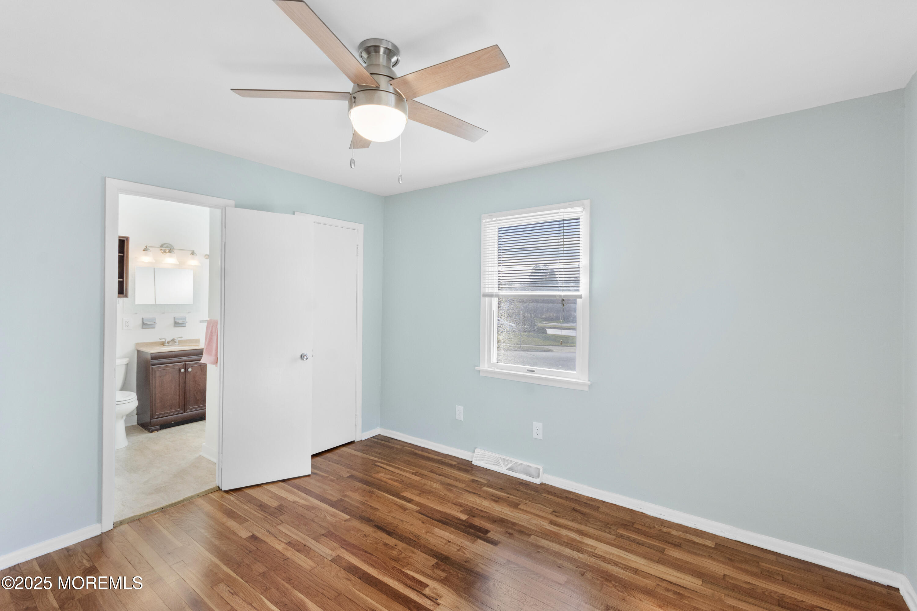 85 Helen Avenue Freehold, NJ 07728 - Photo 12 of 19 wooden floor in an empty room with a window