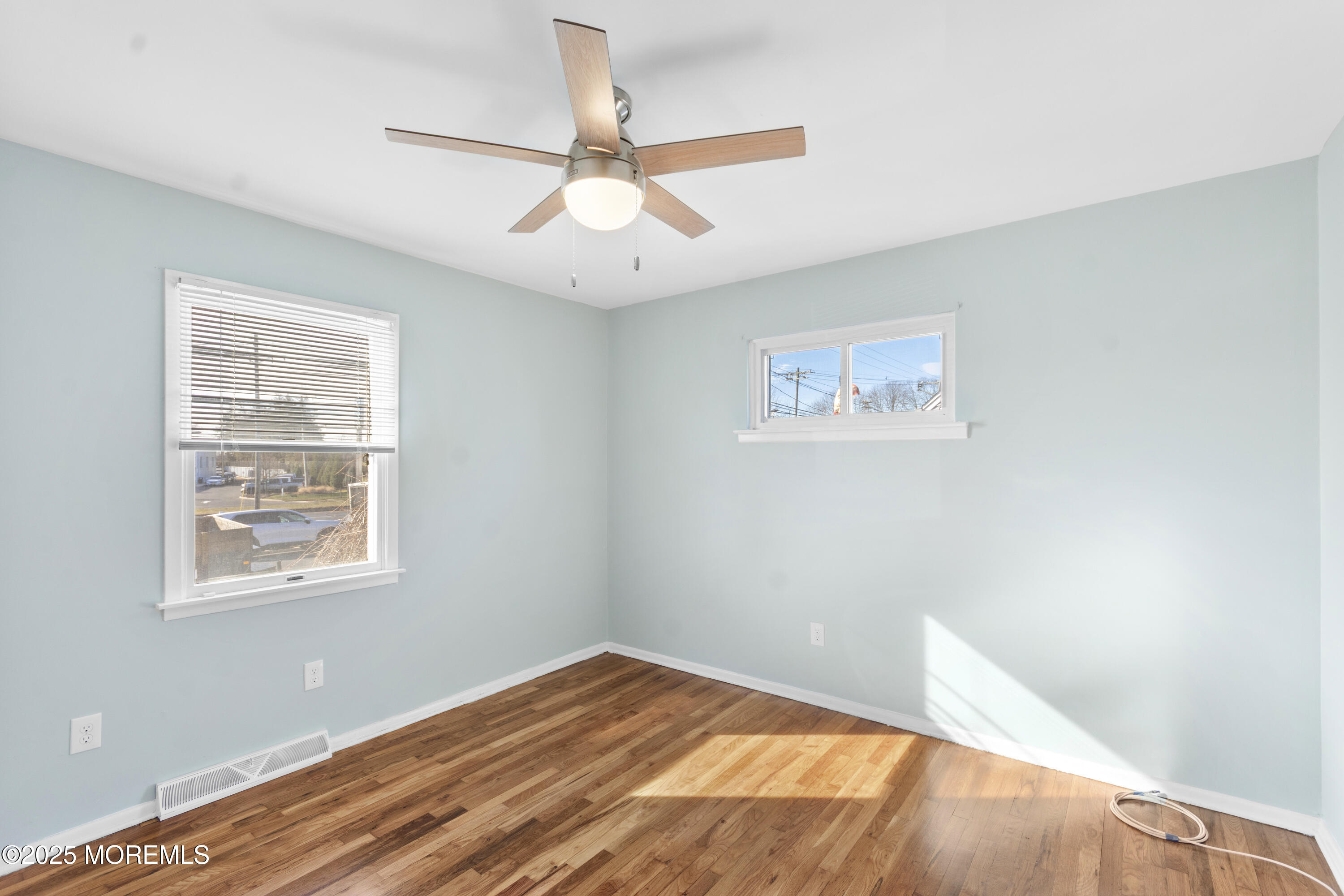 85 Helen Avenue Freehold, NJ 07728 - Photo 13 of 19 a view of an empty room with wooden floor and a window