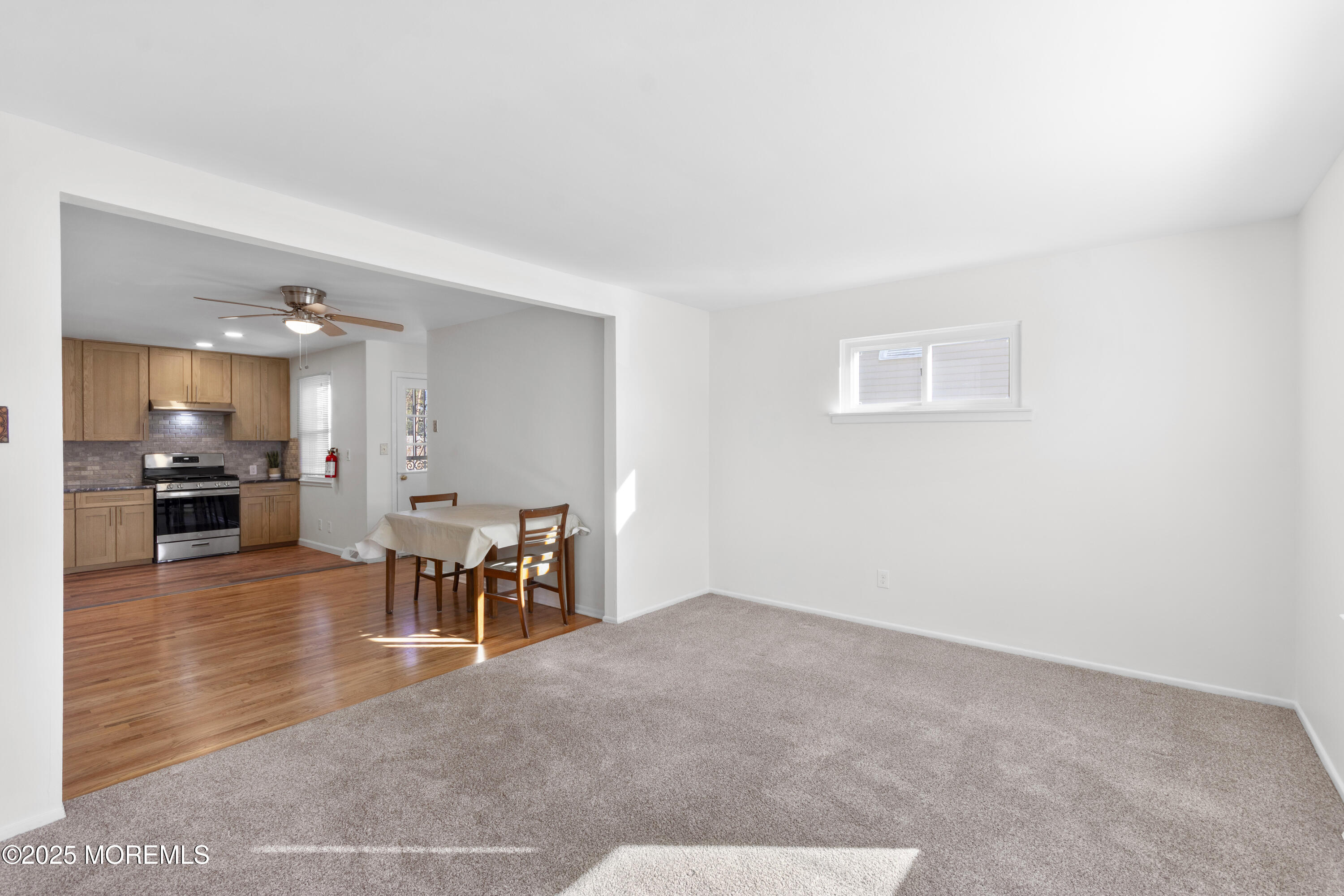 85 Helen Avenue Freehold, NJ 07728 - Photo 9 of 19 a view of a dining room with furniture and a chandelier