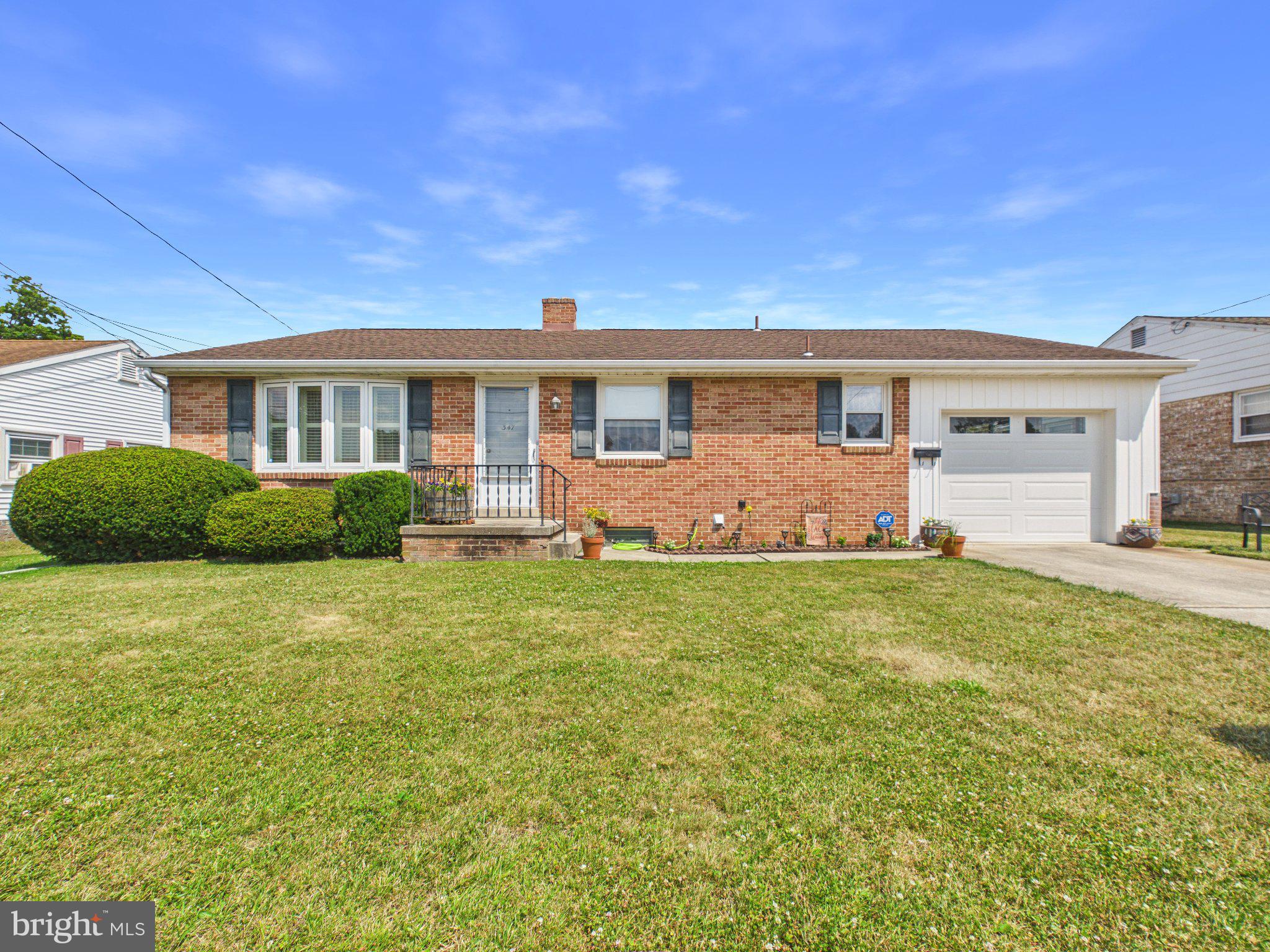 347 George Street Hanover, PA 17331 - Photo 1 of 42 Charming brick home with lush greenery.