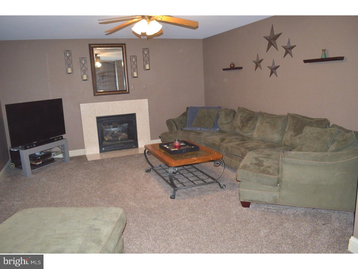 709 Crystle Road Aston, PA 19014 - Photo 2 of 24 a living room with furniture and a flat screen tv