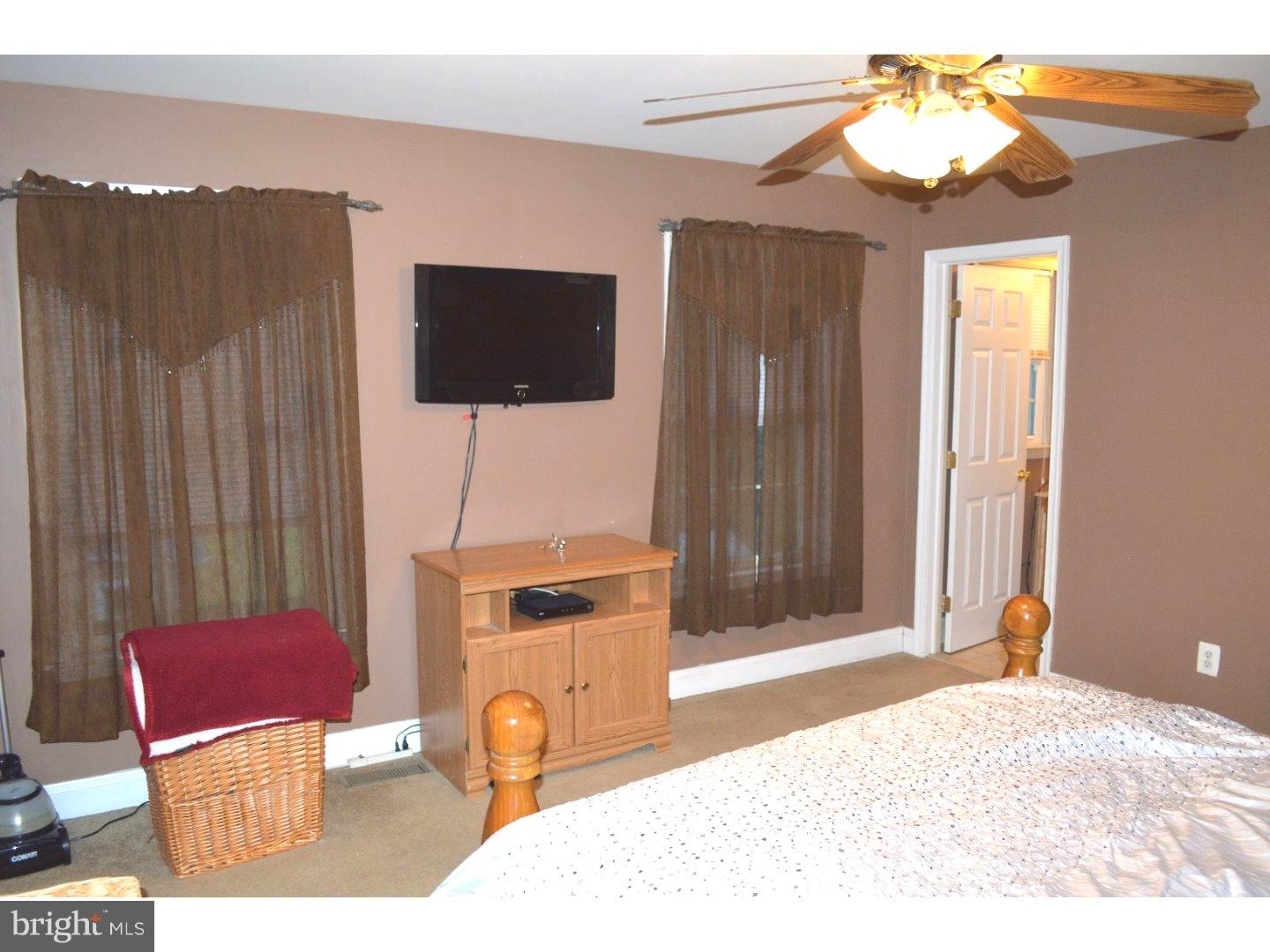 709 Crystle Road Aston, PA 19014 - Photo 15 of 24 a bedroom with a bed and a television