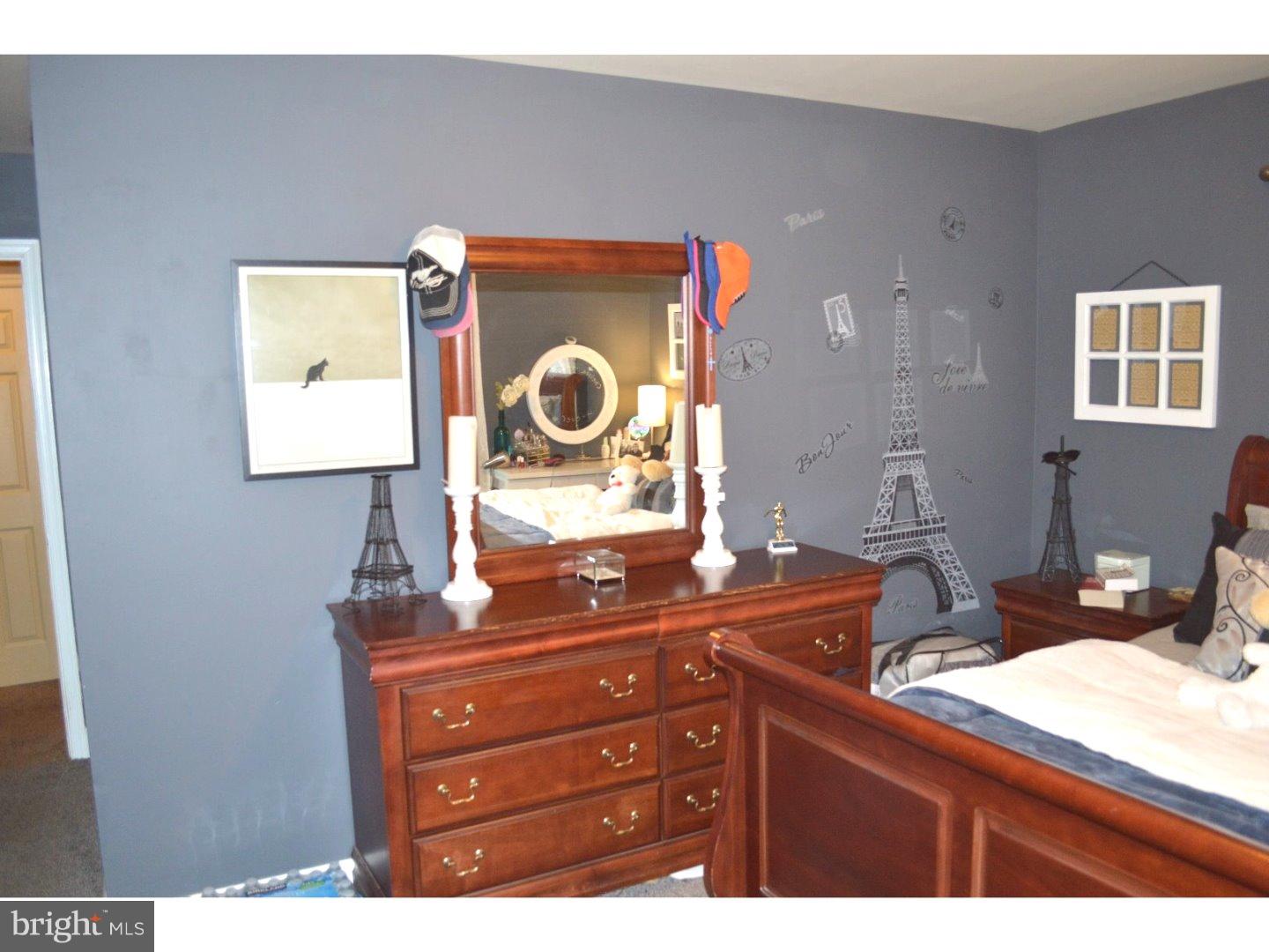 709 Crystle Road Aston, PA 19014 - Photo 18 of 24 a bathroom with a sink and a mirror
