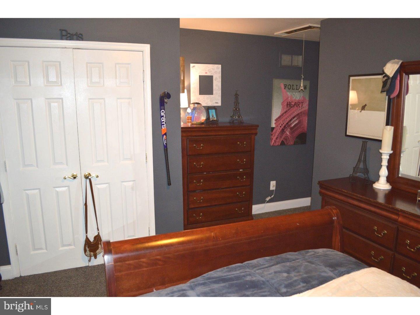 709 Crystle Road Aston, PA 19014 - Photo 19 of 24 a bedroom with a bed and a dresser