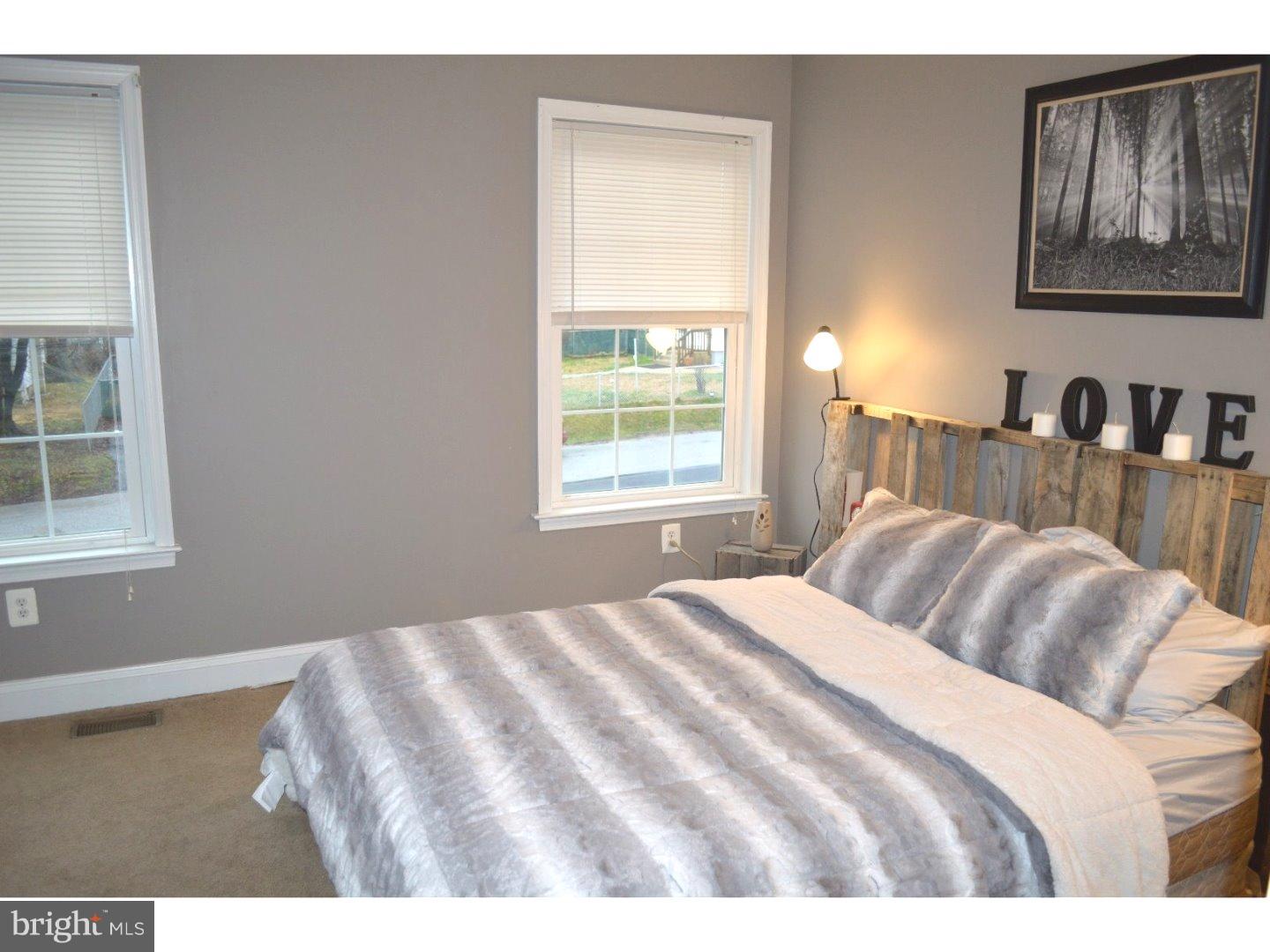 709 Crystle Road Aston, PA 19014 - Photo 21 of 24 a bedroom with a bed and a window