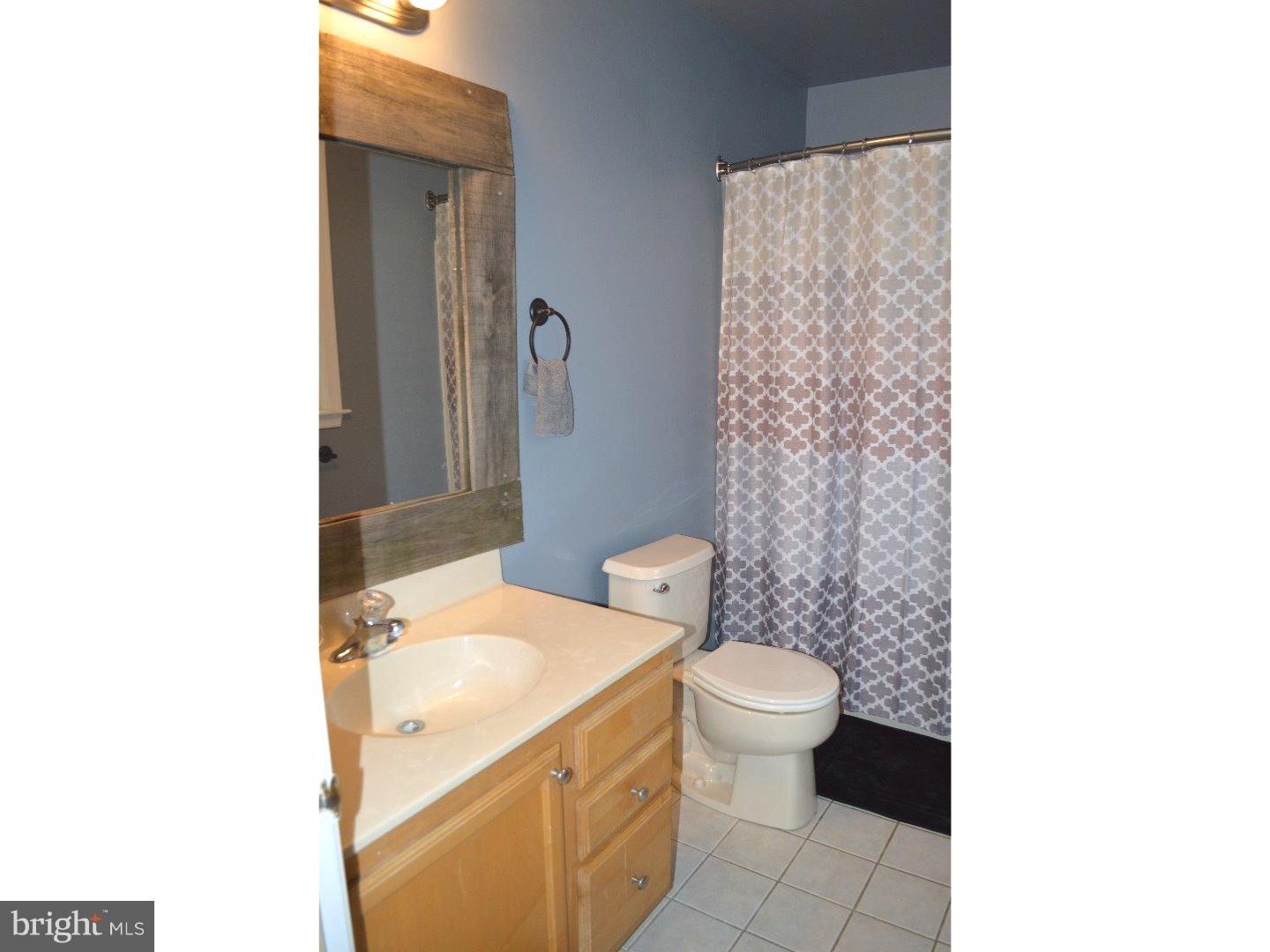709 Crystle Road Aston, PA 19014 - Photo 22 of 24 a bathroom with a sink toilet and shower