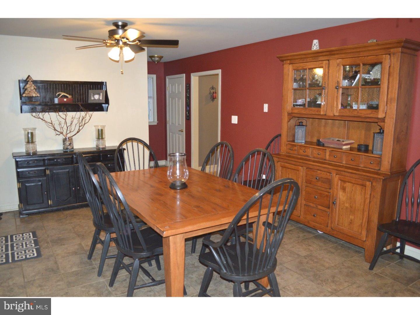 709 Crystle Road Aston, PA 19014 - Photo 8 of 24 a dining room with a wooden table and chairs