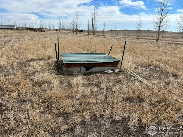 a view of a yard with an outdoor seating