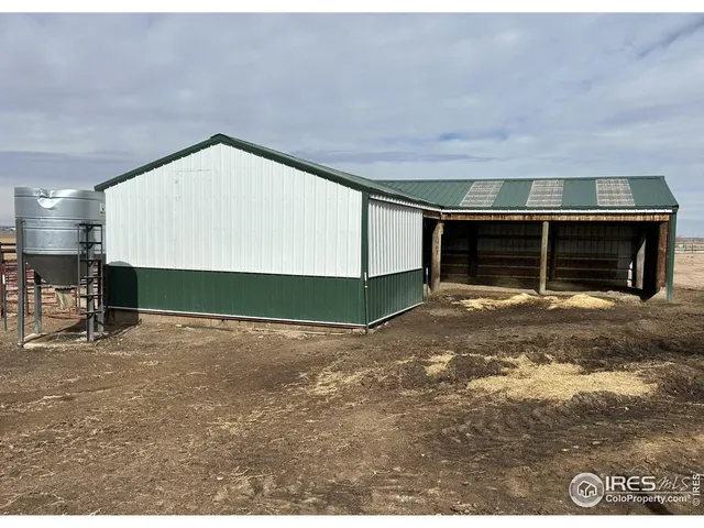 a view of a room with gym equipment and a fireplace