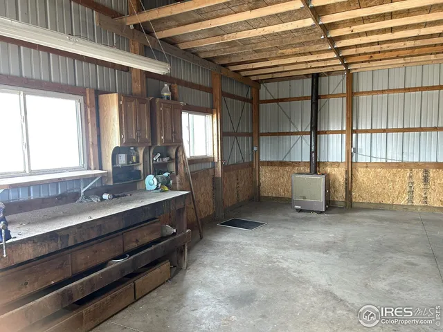 a view of room with window and cabinet