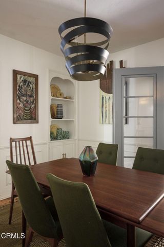 a kitchen with stainless steel appliances a stove a microwave and wood cabinets