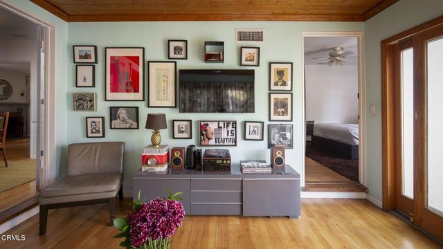 a bedroom with a bed and a chair