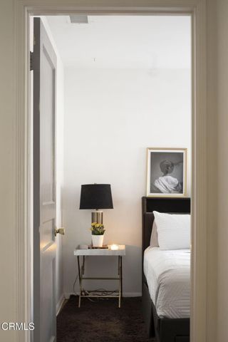 a bathroom with a tub a sink and mirror