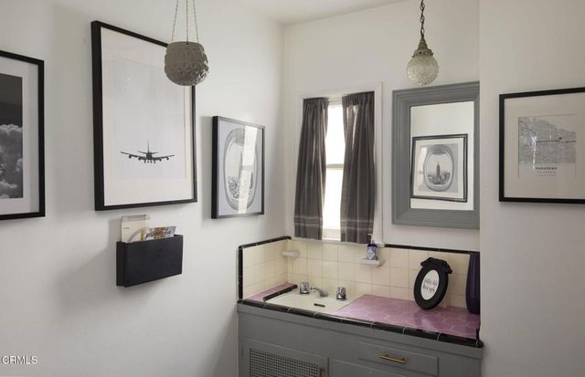 a view of swimming pool with chairs and tables