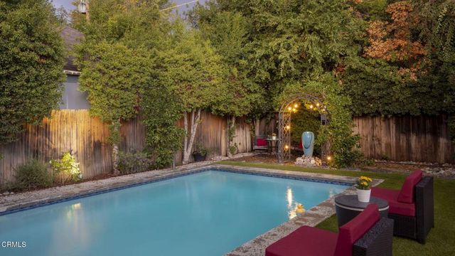 a view of a patio with swimming pool