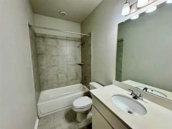a bathroom with a sink double vanity granite tub and shower