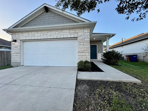 a front view of house with garage and yard