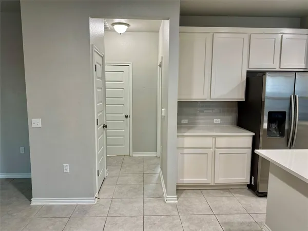 a kitchen with a cabinets and appliances