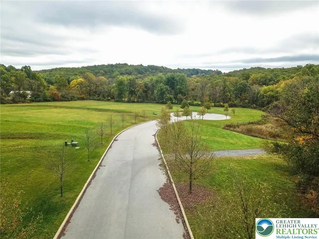 a view of a lake with a yard