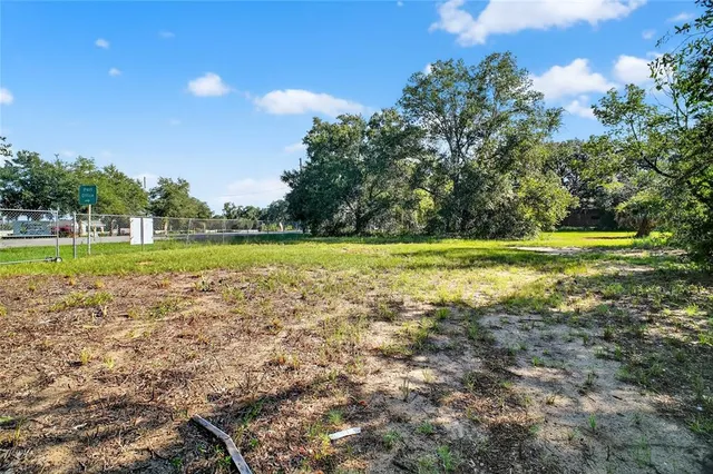 a view of a lake with a big yard