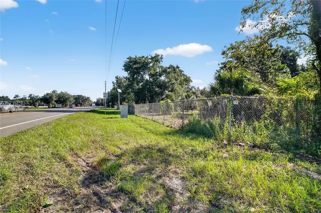 a view of outdoor space with deck and yard