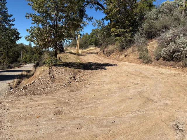 a view of snow on the side of a road