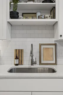 a bathroom with a sink and mirror