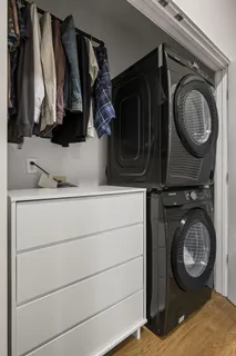 a utility room with multiple dryer and washer