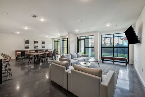 a living room with furniture and a table