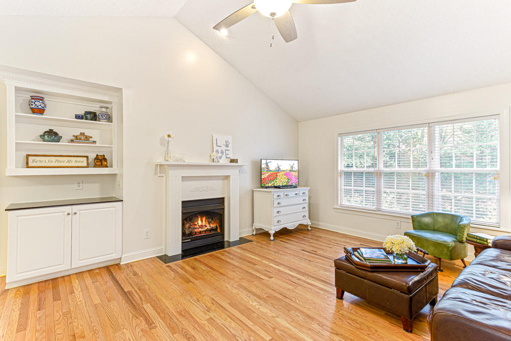 25 Old Hunt Road Pinehurst, NC 28374 - Photo 4 of 47 Refinished hardwood floors. Built in shelving with dental molding and granite top. Fire is for illustrative purposes only.