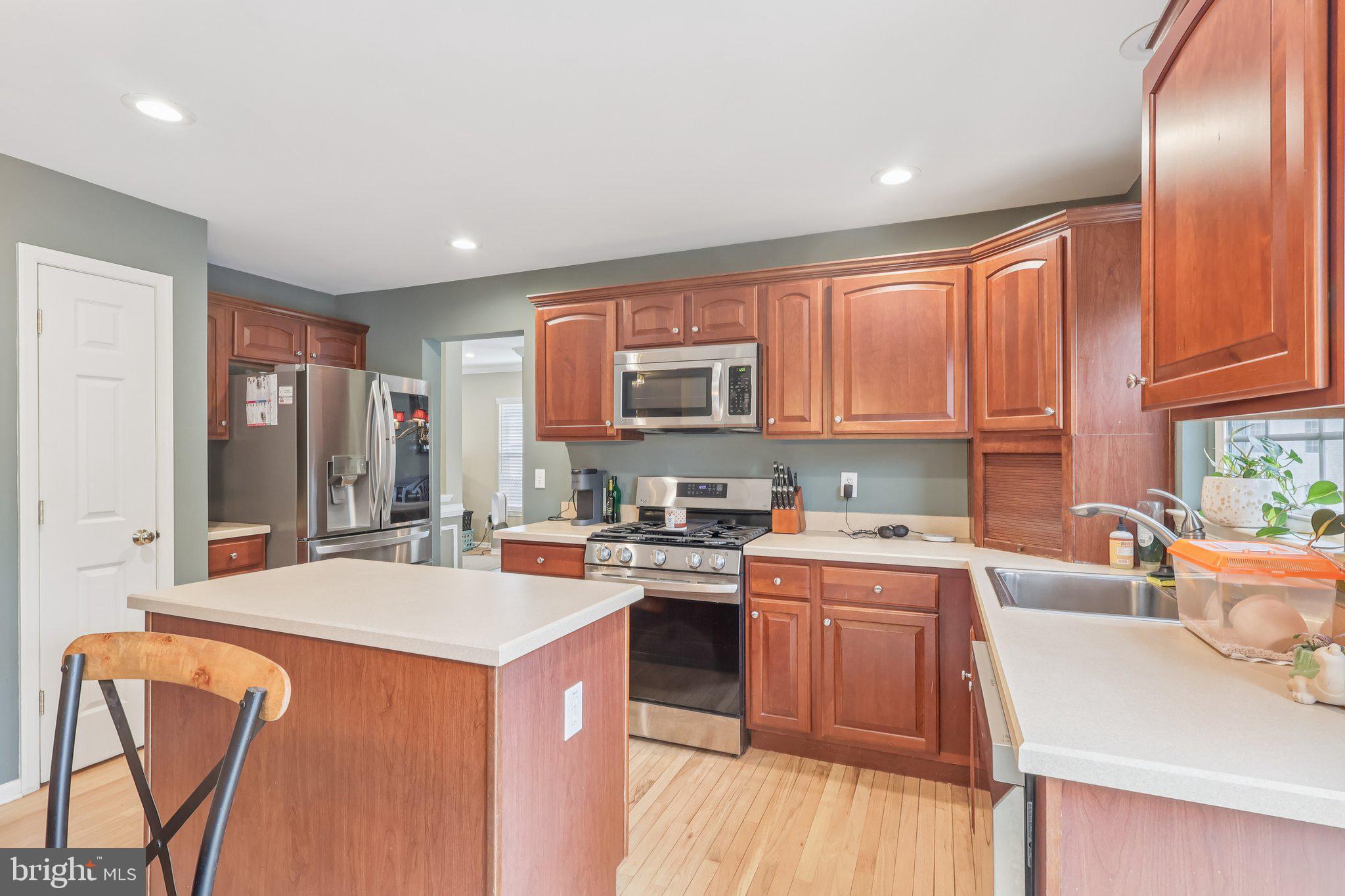 17 Ridgeview Road Delran, NJ 08075 - Photo 12 of 43 a kitchen with stainless steel appliances granite countertop a sink stove and refrigerator