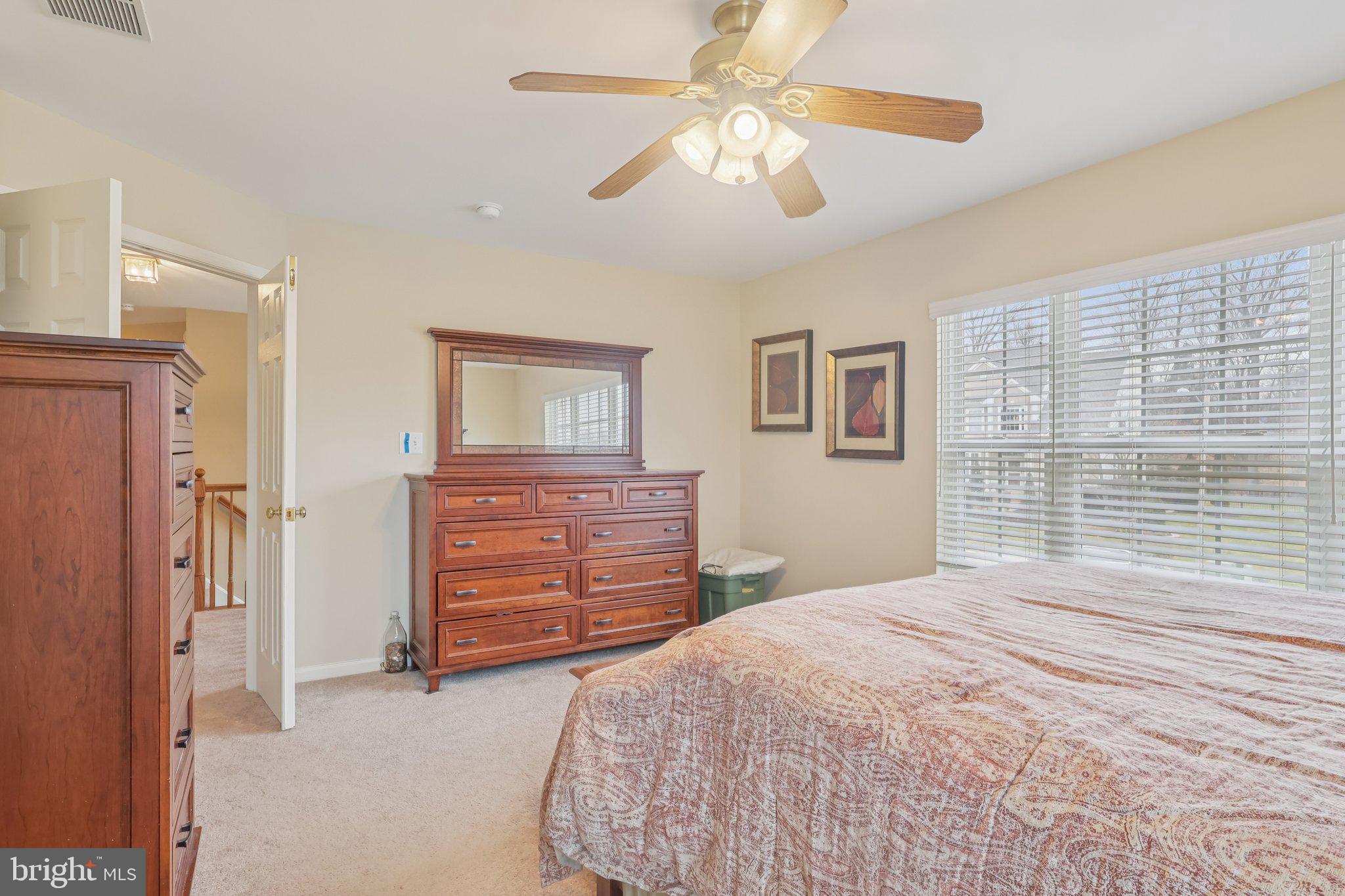 17 Ridgeview Road Delran, NJ 08075 - Photo 21 of 43 a bedroom with a bed and a chandelier